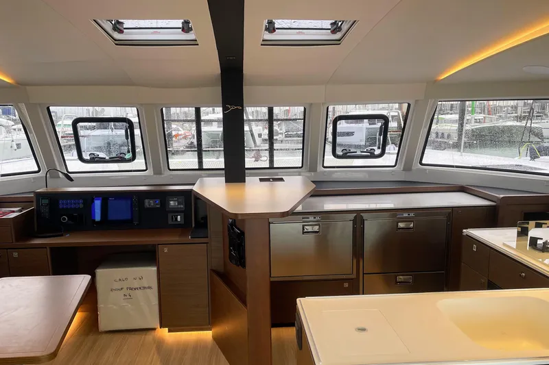  Yacht Photos Pics Interior of 2022 Nautitech 44 Open catamaran with modern kitchen and navigation area.