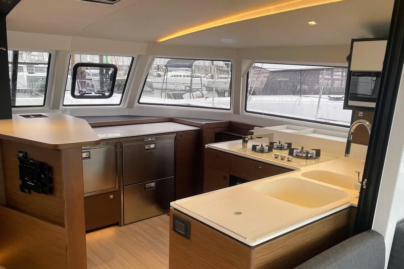  Yacht Photos Pics Modern kitchen interior of 2022 Nautitech 44 Open yacht with sleek design and ample windows.
