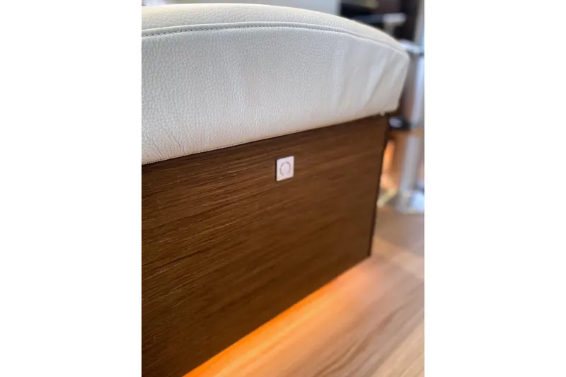  Yacht Photos Pics Interior detail of 2022 Nautitech 44 Open, featuring wood paneling and white upholstery.