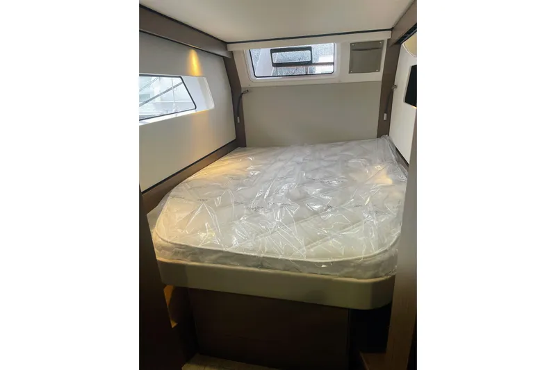  Yacht Photos Pics 2022 Nautitech 44 Open cabin with bed, modern interior design.