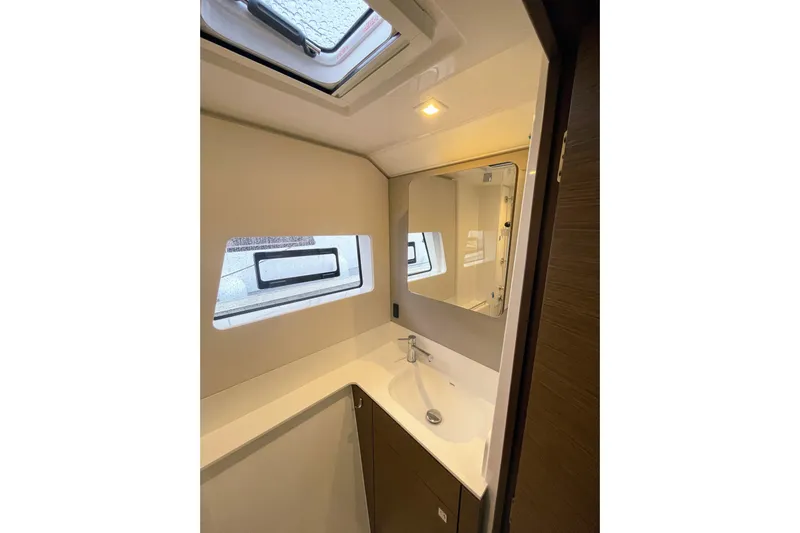  Yacht Photos Pics Modern bathroom interior of 2022 Nautitech 44 Open yacht with sleek design and window.