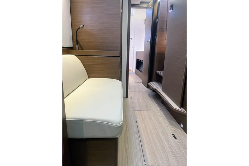  Yacht Photos Pics Interior of 2022 Nautitech 44 Open yacht, featuring modern wood finish and cozy seating.