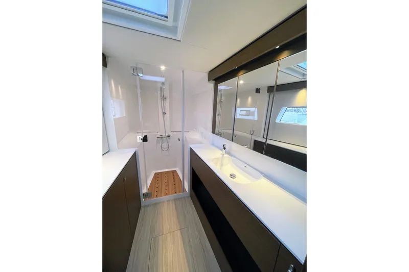  Yacht Photos Pics Modern bathroom interior on 2022 Nautitech 44 Open yacht, featuring sleek design and fixtures.