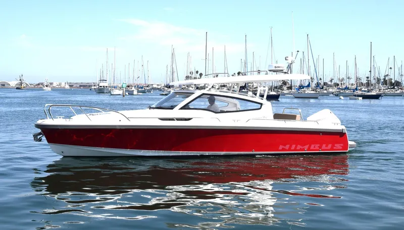Mdr #297 In Stock Yacht Photos Pics 2024 Nimbus W9 boat in marina, red and white design, calm water, clear sky.