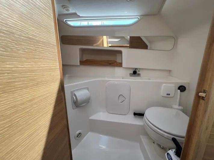 Mdr #297 In Stock Yacht Photos Pics Modern bathroom in 2024 Nimbus W9 boat with sleek design and compact amenities.