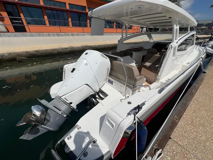 Mdr #297 In Stock Yacht Photos Pics 2024 Nimbus W9 boat docked, featuring sleek design and powerful outboard motor.