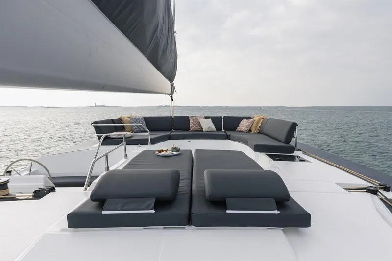  Yacht Photos Pics 2025 Fountaine Pajot Catamaran Aura 51 with luxurious deck seating on open water.