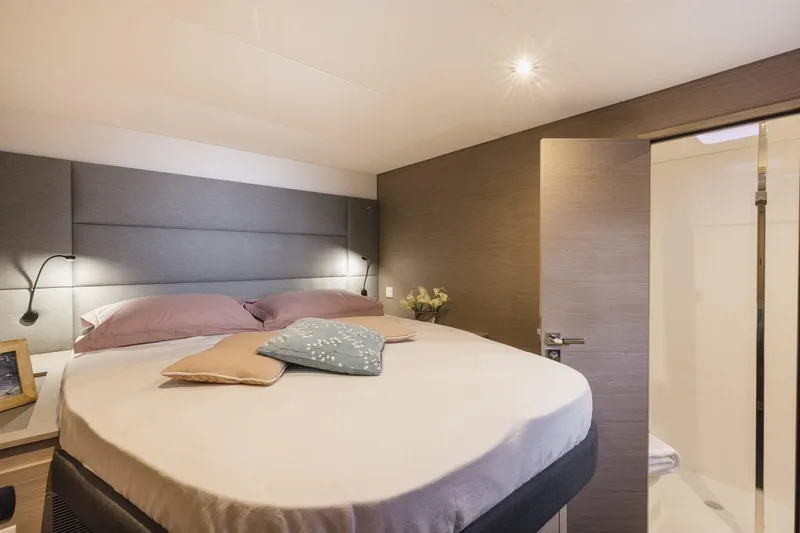  Yacht Photos Pics Luxurious bedroom interior of 2025 Fountaine Pajot Catamaran Aura 51 with modern decor.