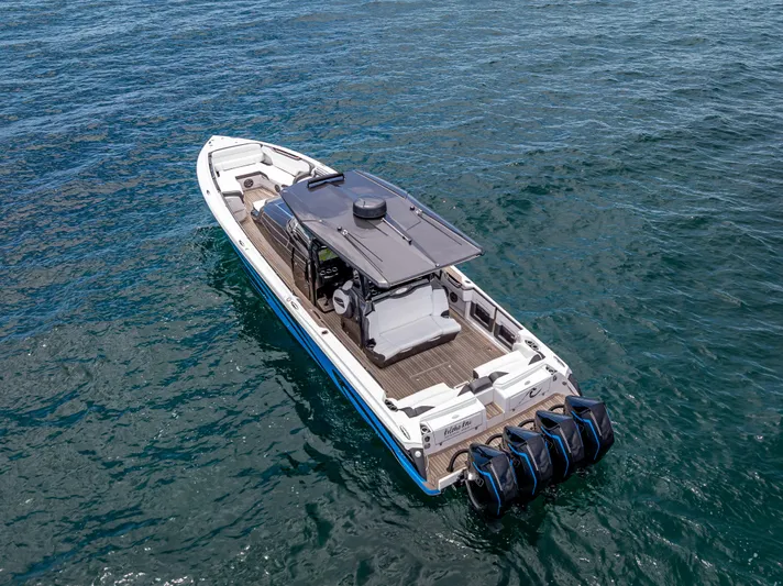  Yacht Photos Pics 2022 Nor-Tech 450 Sport boat on open water, featuring sleek design and powerful engines.