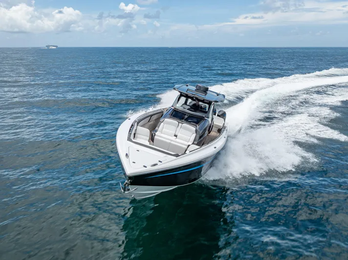  Yacht Photos Pics 2022 Nor-Tech 450 Sport boat cruising on open ocean waters.