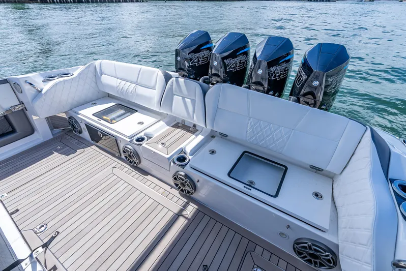  Yacht Photos Pics 2022 Nor-Tech 450 Sport boat interior with seating and powerful outboard engines.