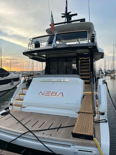  Yacht Photos Pics 2024 Cranchi 67 FLY yacht docked at marina during sunset.