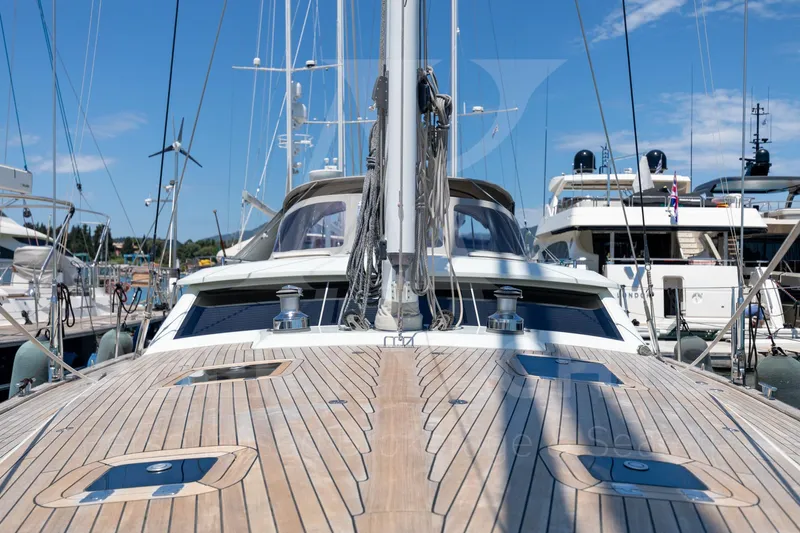 Satori Yacht Photos Pics Sailboat Farr 64, 2005 model, docked in a marina under clear blue skies.
