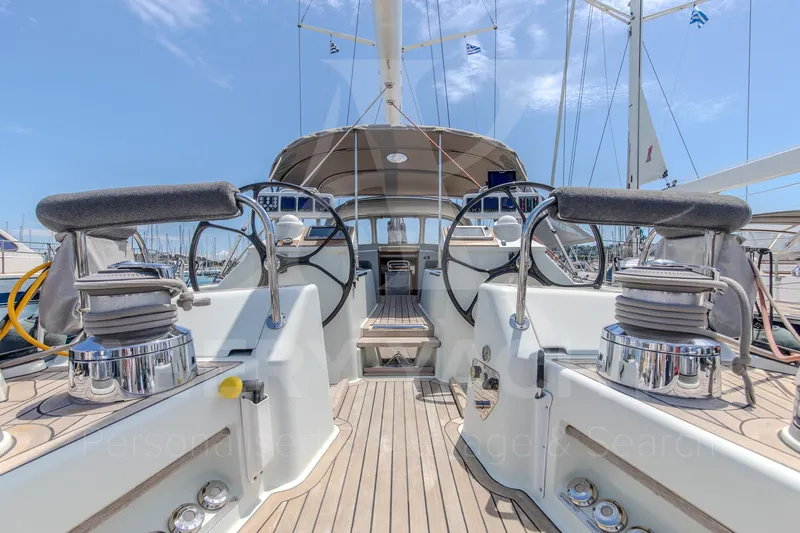 Satori Yacht Photos Pics Luxury Farr 64 yacht deck, dual steering wheels, 2005 model, clear sky background.