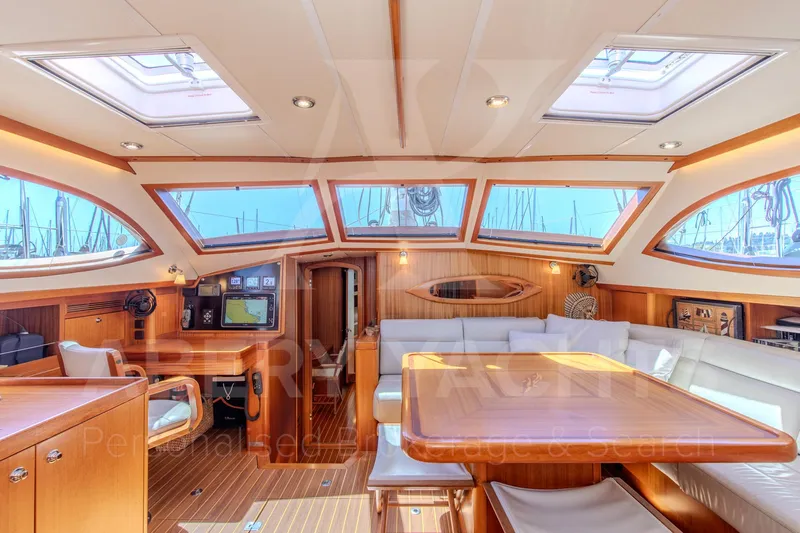 Satori Yacht Photos Pics Luxurious Farr 64 yacht interior, 2005 model, featuring elegant wood finishes and spacious seating.
