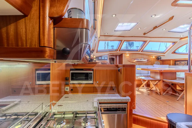 Satori Yacht Photos Pics Luxurious Farr 64 yacht interior, featuring modern kitchen and dining area, 2005 model.