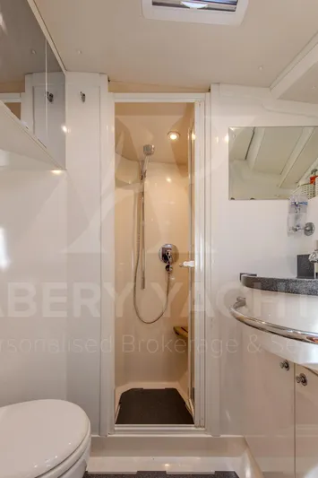 Satori Yacht Photos Pics Luxurious bathroom in 2005 Farr 64 yacht, featuring modern shower and sleek vanity.