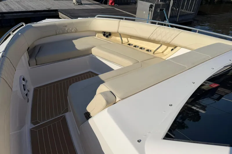  Yacht Photos Pics 2019 Regal 33 SAV boat with spacious beige seating and cup holders.