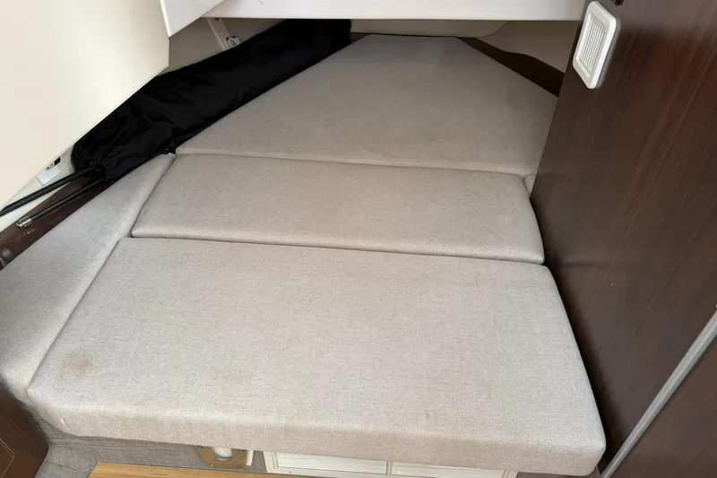  Yacht Photos Pics 2019 Regal 33 SAV boat interior cabin with beige cushions.