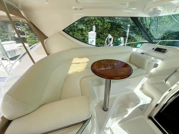  Yacht Photos Pics Luxurious interior of 2008 Tiara Yachts 3900 Sovran with elegant seating and table.