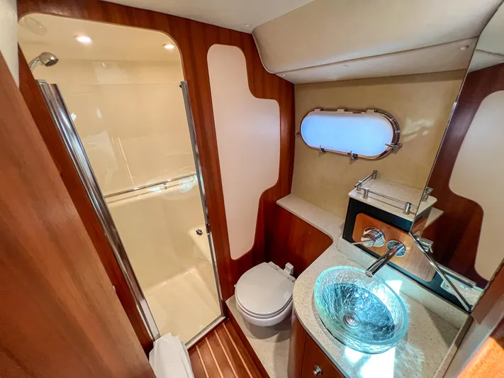  Yacht Photos Pics Luxurious bathroom in 2008 Tiara Yachts 3900 Sovran with glass sink and shower.