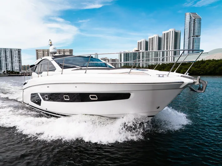 Amici Yacht Photos Pics 2019 Azimut Atlantis 43 yacht cruising near modern city skyline.