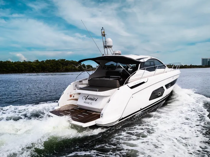 Amici Yacht Photos Pics Azimut Atlantis 43 yacht cruising on water, 2019 model, rear view.