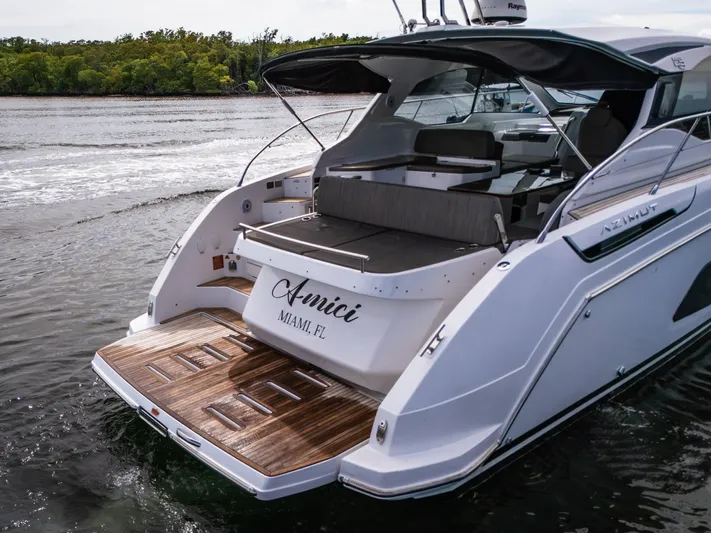 Amici Yacht Photos Pics 2019 Azimut Atlantis 43 yacht with wooden deck, docked in Miami waters.