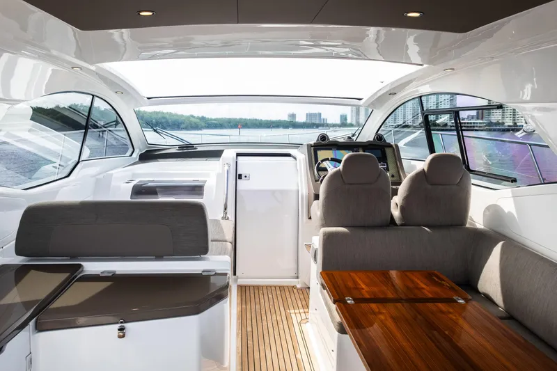 Amici Yacht Photos Pics Interior of 2019 Azimut Atlantis 43 yacht with modern helm and seating area.