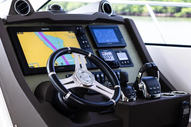 Amici Yacht Photos Pics Cockpit of 2019 Azimut Atlantis 43 yacht with navigation screens and controls.
