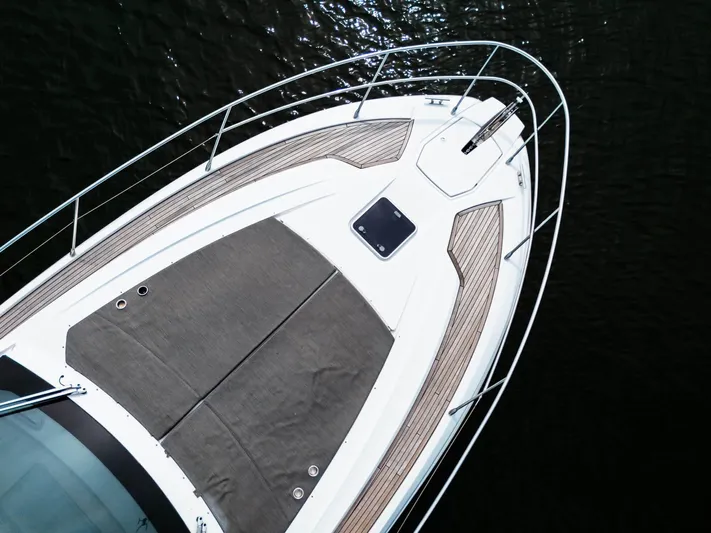 Amici Yacht Photos Pics 2019 Azimut Atlantis 43 yacht bow with sleek design and sunbathing area.