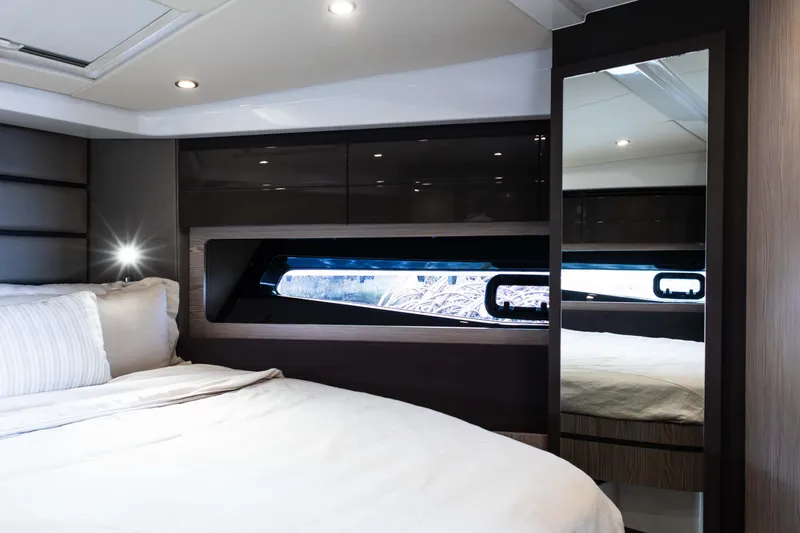 Amici Yacht Photos Pics Luxurious interior cabin of 2019 Azimut Atlantis 43 yacht with modern design and comfortable bedding.