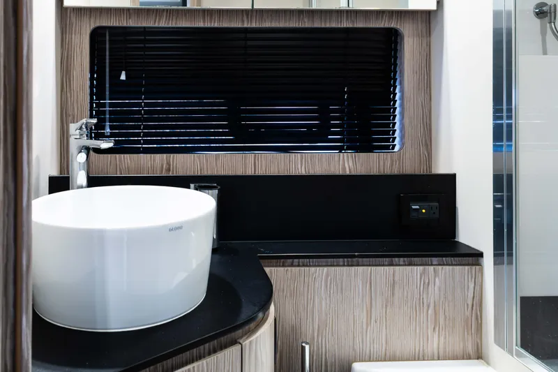 Amici Yacht Photos Pics Modern bathroom interior of 2019 Azimut Atlantis 43 yacht with sleek design elements.