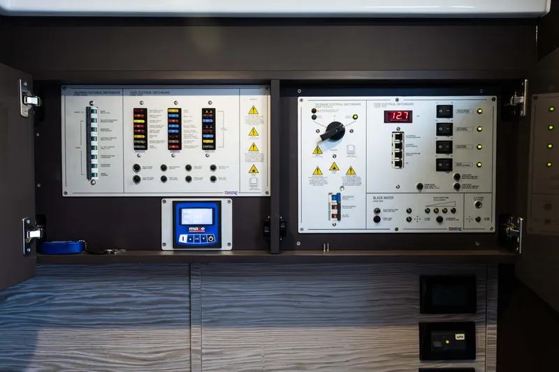 Amici Yacht Photos Pics Electrical control panel on 2019 Azimut Atlantis 43 yacht, featuring switches and digital display.