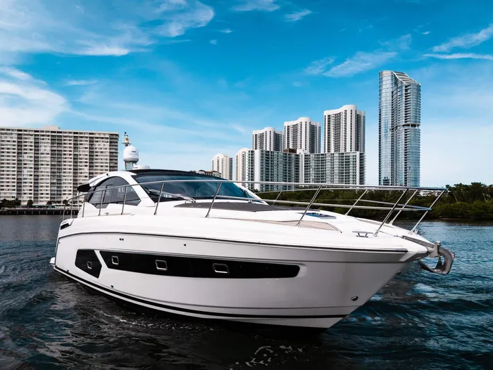 Amici Yacht Photos Pics 2019 Azimut Atlantis 43 yacht cruising near modern city skyline.