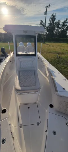  Yacht Photos Pics 2023 Blue Wave 2800 Makaira boat, white interior, sunny day, outdoor setting.