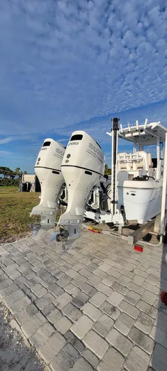  Yacht Photos Pics 2023 Blue Wave 2800 Makaira boat with dual outboard motors on a sunny day.