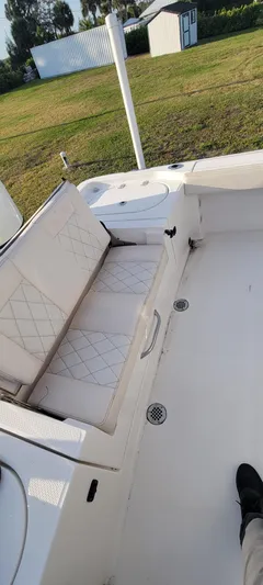  Yacht Photos Pics 2023 Blue Wave 2800 Makaira boat interior with cushioned seating and deck view.