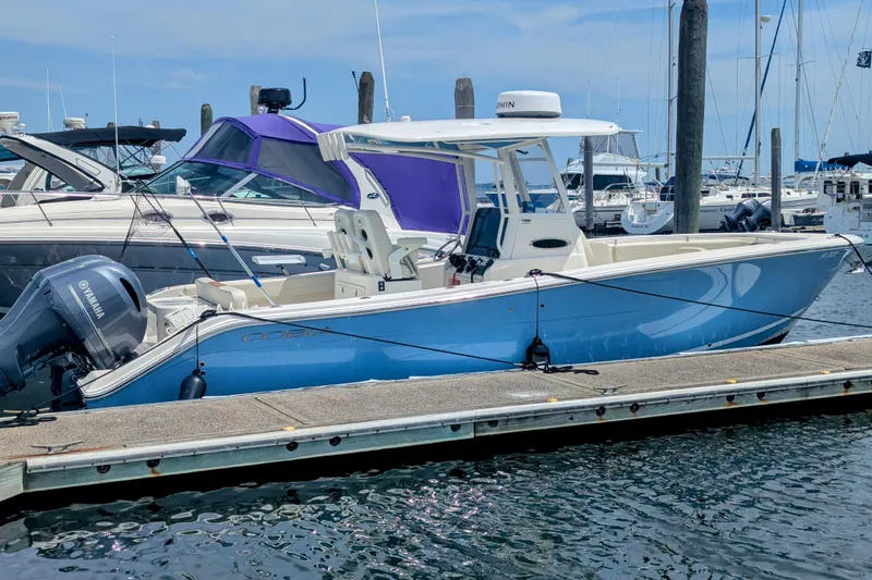  Yacht Photos Pics 2023 Cobia 280 Center Console boat docked at marina with Yamaha engine.