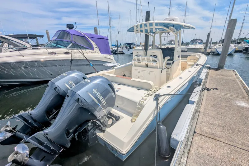  Yacht Photos Pics 2023 Cobia 280 Center Console boat docked with twin Yamaha engines.
