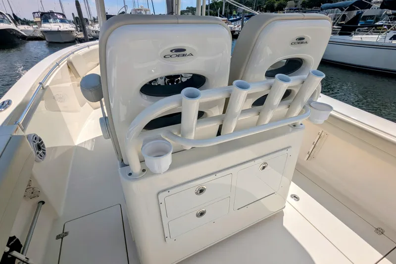  Yacht Photos Pics 2023 Cobia 280 Center Console boat interior with rod holders and storage compartments.