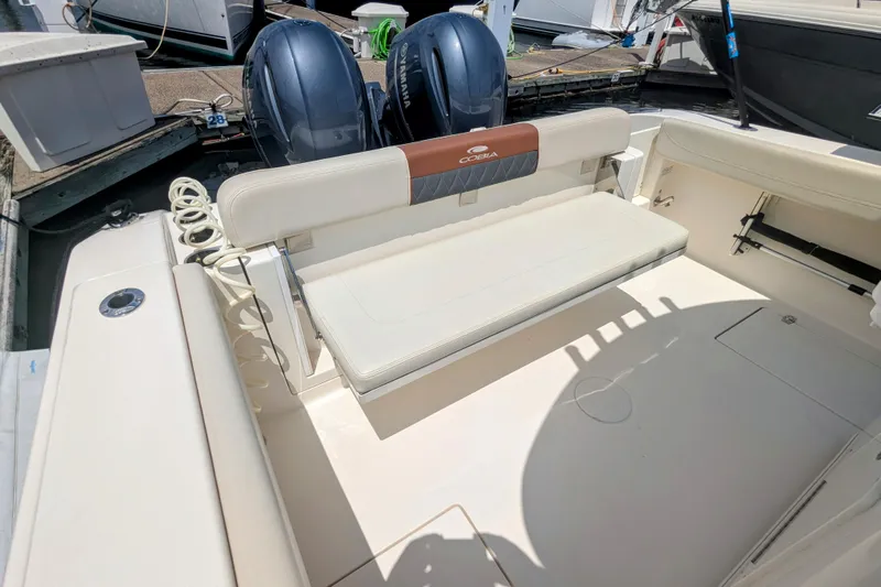  Yacht Photos Pics 2023 Cobia 280 Center Console boat interior with seating and dual Yamaha engines.