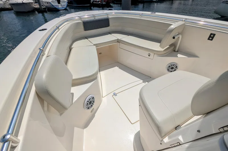  Yacht Photos Pics 2023 Cobia 280 Center Console boat interior with cushioned seating and speakers.