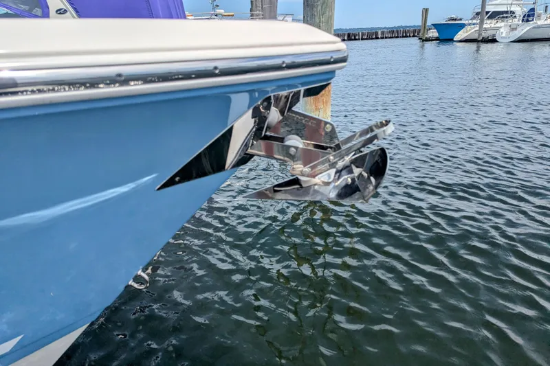  Yacht Photos Pics 2023 Cobia 280 Center Console boat with anchor, docked in marina.