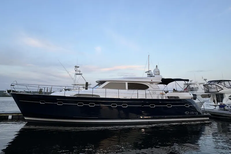  Yacht Photos Pics Luxury 2026 Elling E6 yacht docked at marina during sunset.