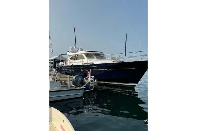  Yacht Photos Pics 2026 Elling E6 yacht docked at marina, sleek design, calm water reflection.