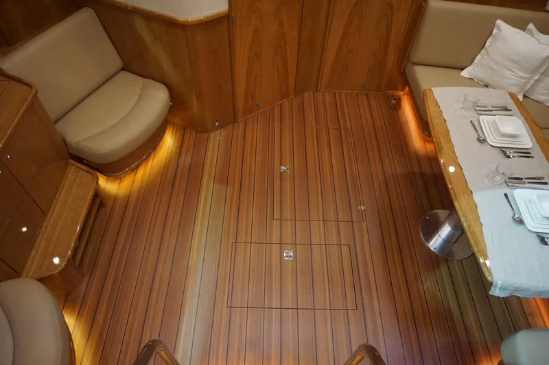  Yacht Photos Pics Luxurious interior of 2026 Elling E6 yacht with elegant wood flooring and dining area.