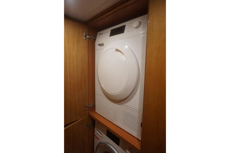 Yacht Photos Pics Laundry appliances in wooden cabinet on Elling E6, 2026 model yacht.
