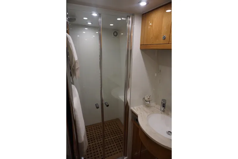  Yacht Photos Pics Luxurious bathroom in 2026 Elling E6 yacht with modern shower and elegant sink.