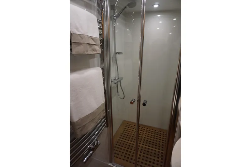  Yacht Photos Pics Modern shower area in 2026 Elling E6 yacht with glass doors and towel rack.